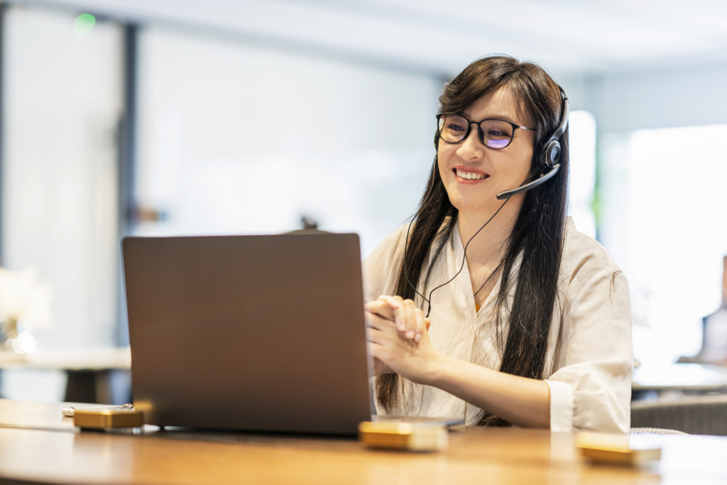 Friendly customer support female operator at office.