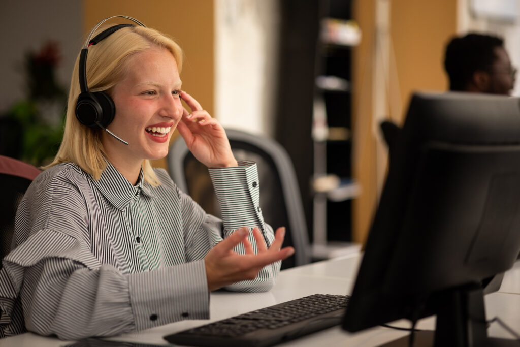 Happy young Caucasian woman working as a learner support employee