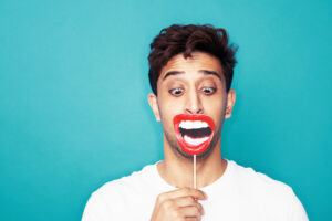 man shouting and making face
