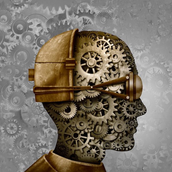 silhouette of head made out of gears