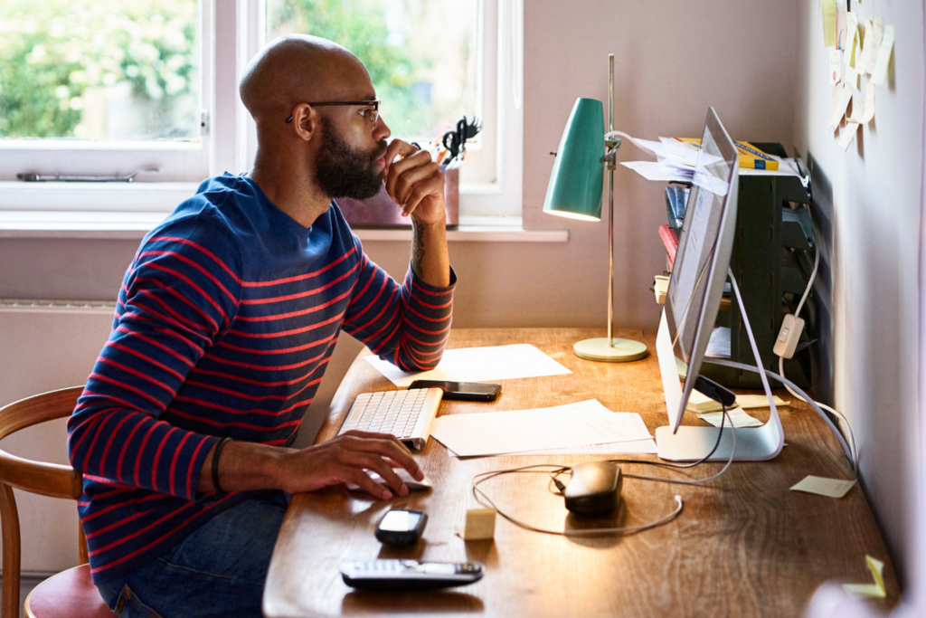Man using computer in home office