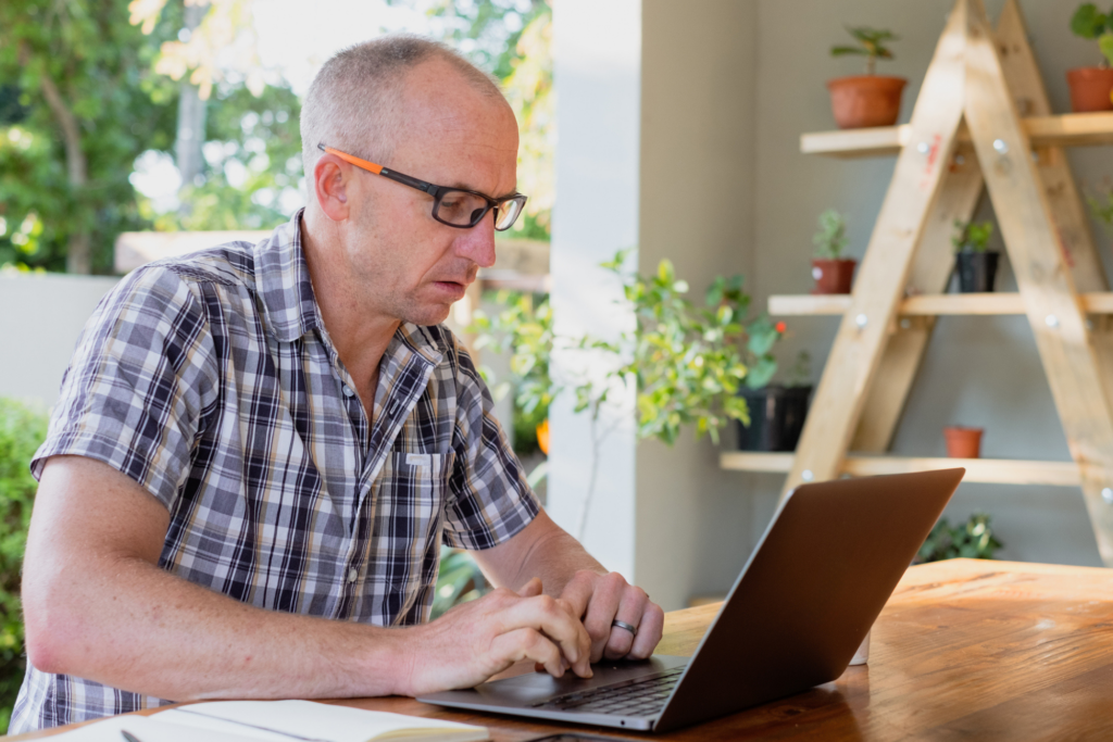 Man typing at his computer