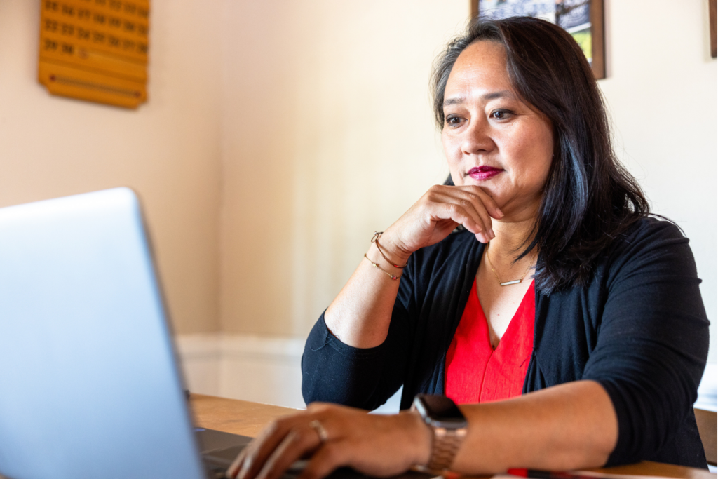 A mature Filipino woman using fintech to make decisions