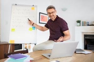 teacher explaining during online lesson on video call from home