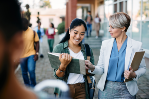 University teacher talking to her Asian female student at campus