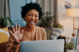 Shot of a young woman making a video call on a laptop at home
