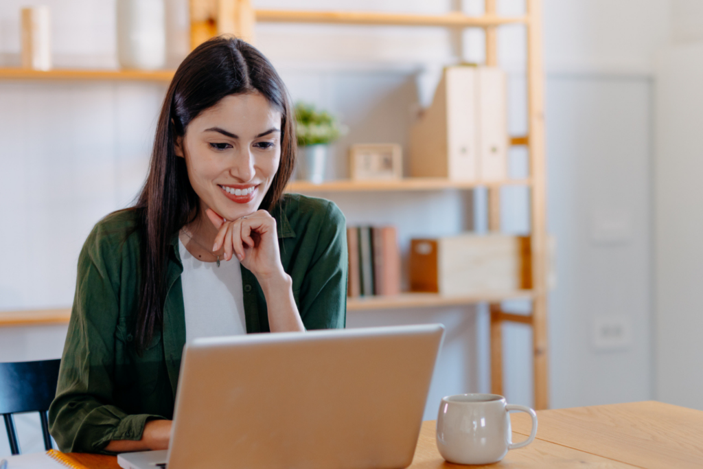 Woman reading emails at her desk.