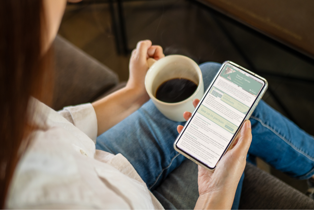Woman checks the faculty center newsletter on her phone