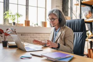 Smiling mature woman remote working
