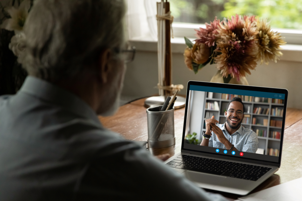 Senior male student watching webinar